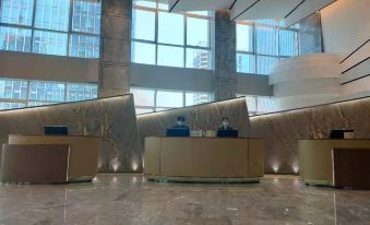 The lobby of Person's hotel in Singapore offers a view of surrounding buildings from the interior at Shenzhen Hyde Hotel