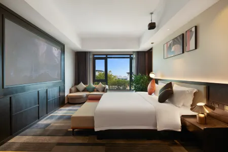 Xinghe Grand Hotel Отели рядом с достопримечательностью «Giant Buddha in Rong County»