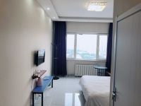 七彩假日酒店式公寓(哈尔滨服装城店) - 特惠大床房