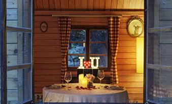 There is a table at Horseshoe Bay with two candles and wine glasses on it at Grand Millennium Shanghai HongQiao