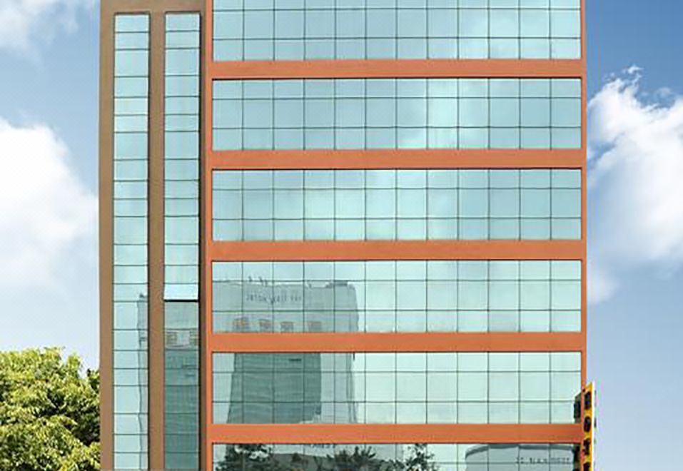 "a tall building with a sign that reads "" shangri - la regency hotel "" prominently displayed on the side of the building" at Hallmark Regency Hotel - Johor Bahru