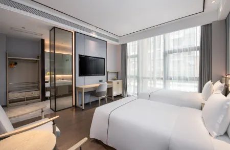 Huaxuanli Hotel (Shenzhen Universiade Center) Отели рядом с достопримечательностью «Baoneng All City Shopping Center Longgang Branch (Jianshe Road)»