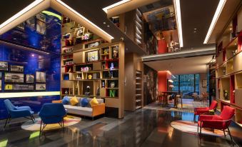 The lobby features a modern design and includes its own bar at Hampton by Hilton Beijing Guomao CBD