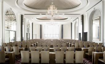 There is a spacious ballroom with rows of chairs available for hosting events or formal functions at The Langham, Shenzhen