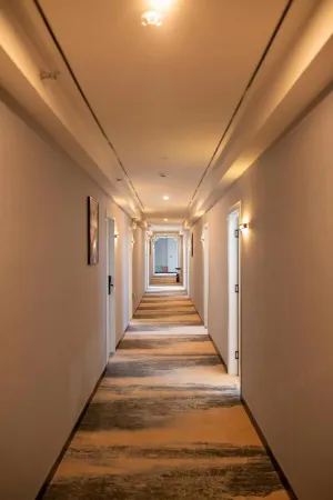 Meixu S Hotel (Zhangjiagang Tangqiao Needle Textile City High Speed Rail Station Store) Отели рядом со станцией Zhangjiagang Railway Station