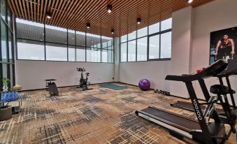 A spacious and well-lit room in the center that is impeccably clean is available for exercise at OSK International Hotel