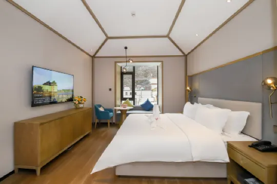 Qianhe Rezen Hotel Отели в г. Цзючжайгоу