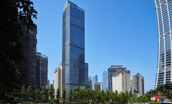 A city with tall buildings and people on the ground in front at ISEYA HOTEL Chaotianmen Chongqing