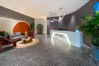 Huajian Meisu Hotel (Xinyang Railway Station Tianrun Plaza)