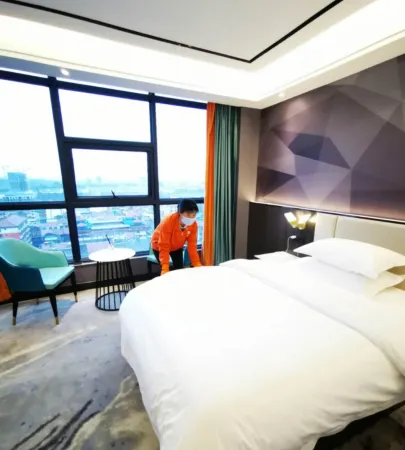 ORANGE HOTEL Отели рядом с достопримечательностью «Teng Daiyuan Memorial Hall»