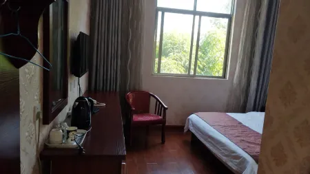 Yongsheng Shunxinyuan Hotel Отели в г. Юншэн