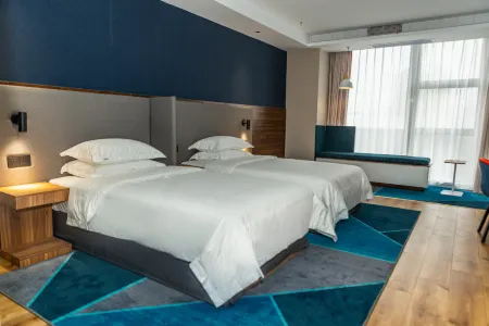 Gujing Junlai Hotel (Taihe Sports Center Branch) Отели в г. Тайхэ