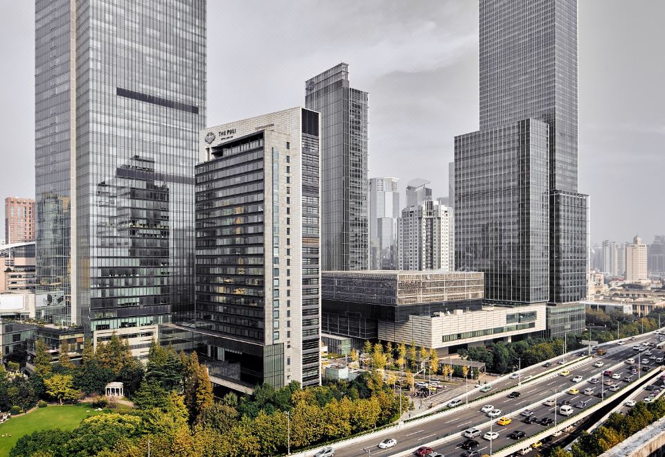 A city with tall buildings and large skyscrapers on both sides at The Puli Hotel and Spa