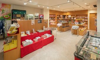 a large bookstore with aisles filled with various books on display , creating an inviting atmosphere for browsing and reading at Kamenoi Hotel Atami Annex