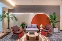 Huajian Meisu Hotel (Xinyang Railway Station Tianrun Plaza)