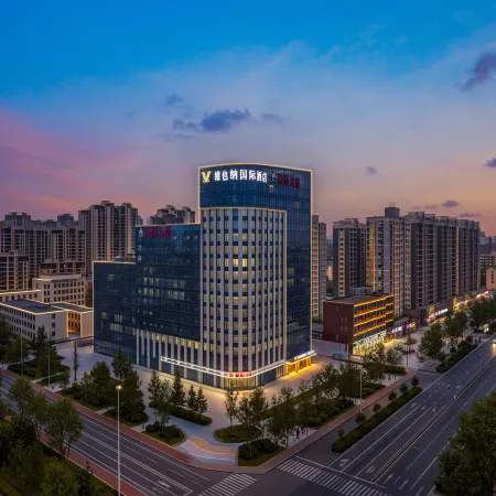 Vienna International Hotel (Heze Shan Development Zone Shunshi Building)