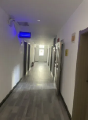Huanhuan Hotel (Xiayuan Commercial City) - Losmen