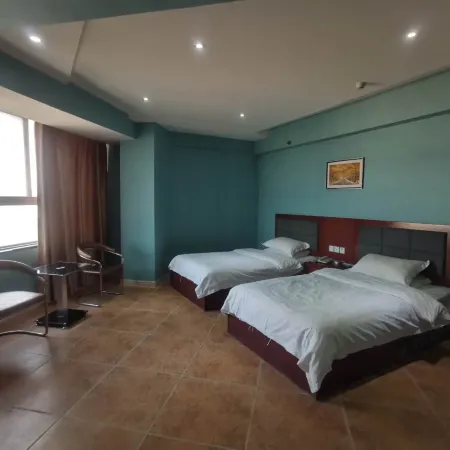 Weihui Yiju Hotel (Bus Station) Отели в г. Вэйхуэй