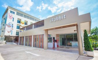 "a building with the name "" rabbit "" on it , and a sign above the entrance indicating that it is a storefront" at IRabbit Hotel
