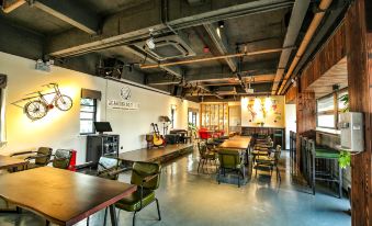 The restaurant features tables and chairs in the center, alongside an open space at Hangzhou Wulin International City Camp (West Lake Wulin Gate Subway Station Store)