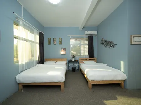 Q+ Palm Bay Art Hostel Отели рядом с достопримечательностью «Международная прибрежная туристическая зона Сичонг»