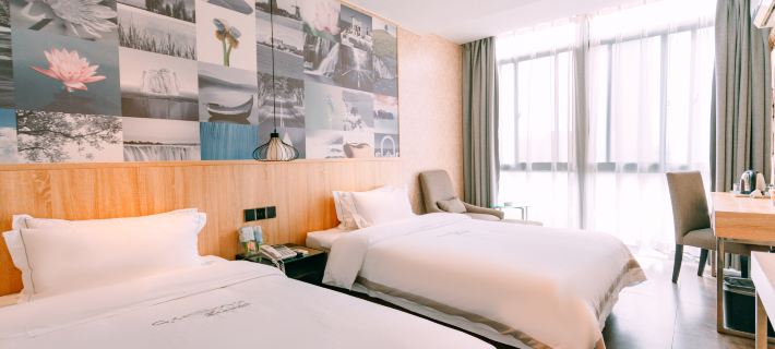 Qingmu Chain Hotel (Ma'an Shandong Railway Station Hongxing Meikailong RT-Mart) Hotele w: Ma’anshan
