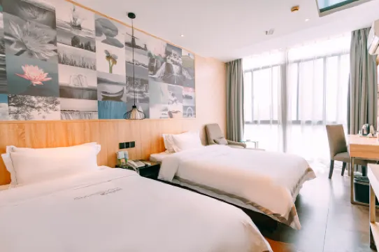 Qingmu Chain Hotel (Ma'an Shandong Railway Station Hongxing Meikailong RT-Mart)