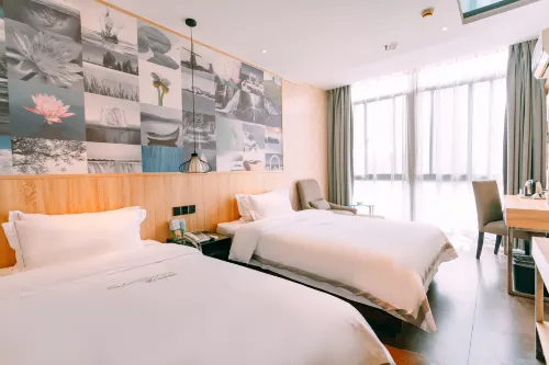 Qingmu Chain Hotel (Ma'an Shandong Railway Station Hongxing Meikailong RT-Mart)