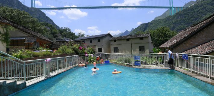 Xiaohuajiang Buyi Qiaoyuan Homestay Hôtels à&nbsp;: Zhenfeng
