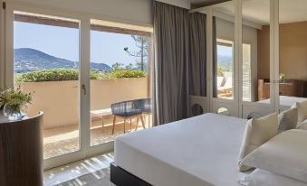 Baia Chia Laguna Resort, Curio Collection by Hilton