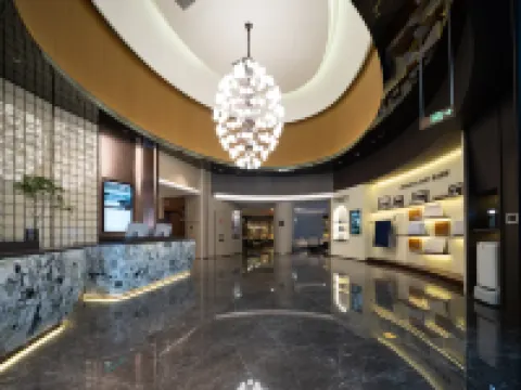 Turpan Guotai Minsheng Plaza Junmin Gongjian Lyuaduo Hotel