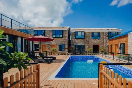 Weizhou Island Coral Residence Homestay (Catholic Church Beike Beach) Отели рядом с достопримечательностью «Wucai Beach»