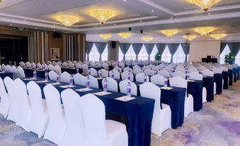 a ballroom with tables and chairs arranged for an event at Earl Family Hotel Jiaxing Nanhu