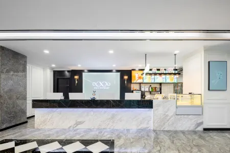 Xana Hotelle Hotel (Haicheng Railway Station Binhe Xi Road) Отели рядом с достопримечательностью «Kuixing Building»