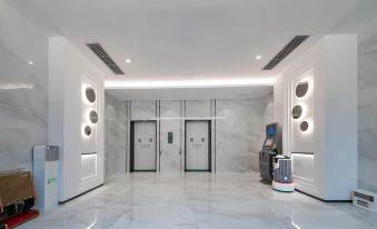 Xingfu Holiday Hotel (Buji Shenzhen East Railway Station Branch)