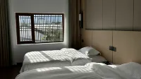 Wuyuan Chenwai Muquan Hot Spring Homestay - พร้อมระเบียง