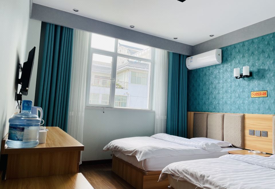 Lixian Xinyi Hotel - Housity
