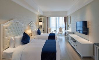 The spacious bedroom features double beds and a connected sitting area at Guoce International Conference and Exhibition Center