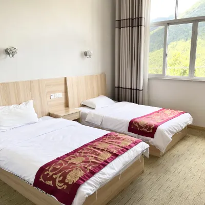 Yuanyuan Xingfu Building Hotel di Qingyuan Village (East Route)