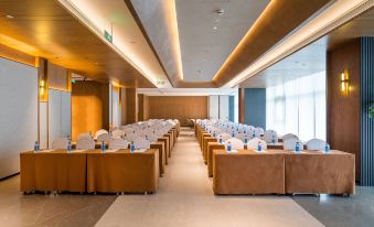 A spacious room with long tables and chairs is available at the hotel for hosting events or functions at UrCove by HYATT Nanjing South Railway Station