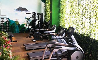 There is a gym in the middle with treadmills and exercise equipment, as well as an indoor area at Burlington Hotel