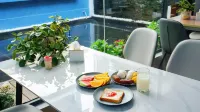 โรงแรมจิ้งเยว่ (จ้าวชุน ซิตี้ที่ 1) - พร้อมอาหารเช้า