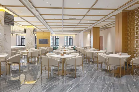 Xingguang Huayuan Hotel (Ordos Municipal Government) Отели рядом с достопримечательностью «Kangbashi Ulanmulun Lake Music Fountain»