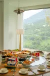 Enshi Yuejian Qingjiang Homestay - servizio colazione