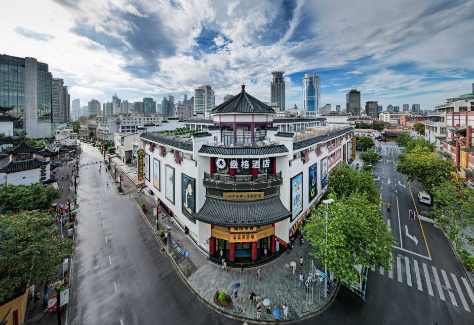 Aerial view of an Asian city reveals its prominent architecture and bustling streets at Autoongo Hotel On the Bund, Shanghai