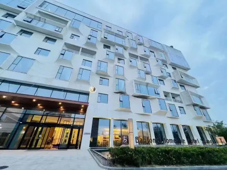 Shanghai Baolong Home Hotel (Ma'anshan Dangtu East Station Branch) Отели в г. Данту