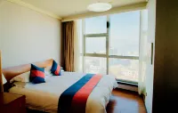 Dongfang Jinzuo Apartment Hotel - Condos