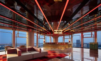 The elegant center of the living room features large windows and floor-to-ceiling glass at Radisson RED Guang Zhou South Railway Station