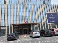 G+設計師アパートホテル - 駐車場