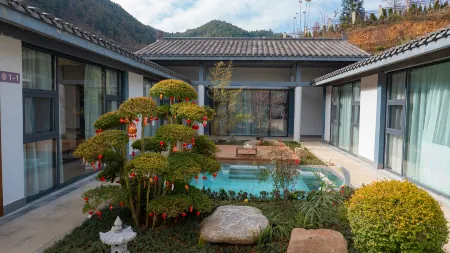 Jiugu Shui Hot Spring Courtyard Отели в г. Хечжан